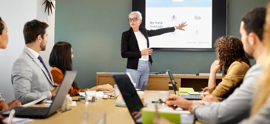 Woman presenting in a board room